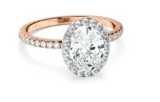 Oval Cut Diamond Halo Engagement Ring With Pave Band