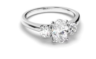 Oval Cut Diamond Trilogy Engagement Ring with Round Brilliant Sides