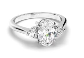 Oval Cut Diamond Trilogy Engagement Ring with Round Brilliant Sides