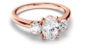 Oval Cut Diamond Trilogy Engagement Ring with Round Brilliant Sides