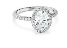 Oval Cut Diamond Halo Engagement Ring With Pave Band