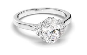 Oval Cut Diamond Engagement Ring with Diamond Cluster Sides