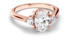 Oval Cut Diamond Trilogy Engagement Ring with Round Brilliant Sides