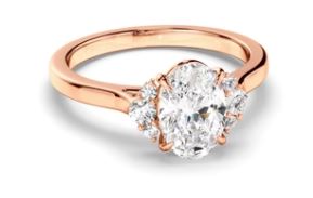 Oval Cut Diamond Engagement Ring with Diamond Cluster Sides