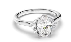 Oval Cut Diamond Engagement Ring with Diamond Cluster Sides
